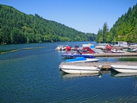 boats line docks extending into North Fork Reservoir