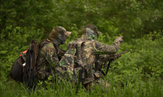 photo of two turkey hunters wearing lots of camo