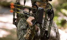 image of bow hunter safely carrying bow and arrows