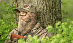 image of a turkey hunter set up in front of a large tree