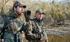 image of two hunters using a locator call to find turkeys