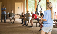 image of archery instructor explaining range rules