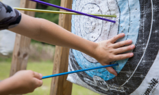 image of arrows being properly pulled from a target