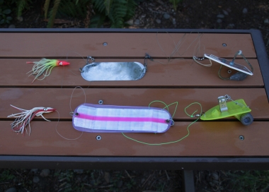 a photo of two different hoochie and diver rigs for ocean coho fishing