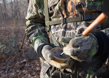 image of a hunter striking a slate with the striker