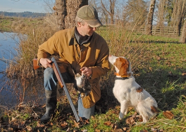 photo of a snipe hunter with his dog