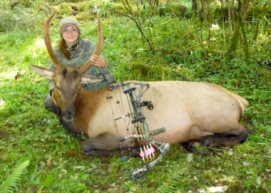 Young archery hunter with a spike elk from southwest Oregon.