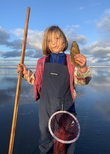 "A proud clammer displaying her catch."