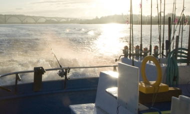image of an ocean charter boat leaving Newport