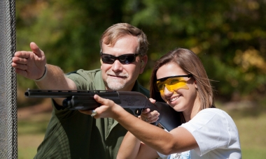 image of a shotgun instructor helping student