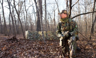 image of a hunter outside of a turkey ground blind