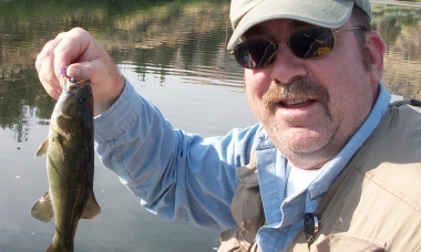 image of angler holding up a small smallmouth bass on the John Day R
