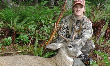 Hunter posing with a nice buck deer