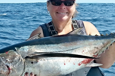 Angler holding a large albacore tuna