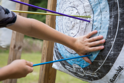 image of arrows being properly pulled from a target