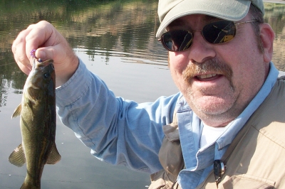 image of angler holding up a small smallmouth bass on the John Day R