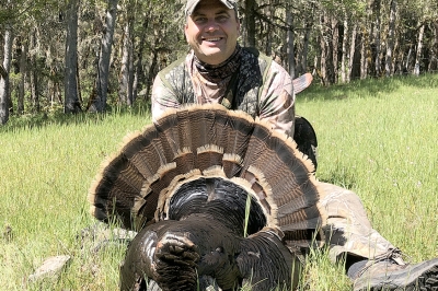 Hunter showing the fanned tail of a tom turkey
