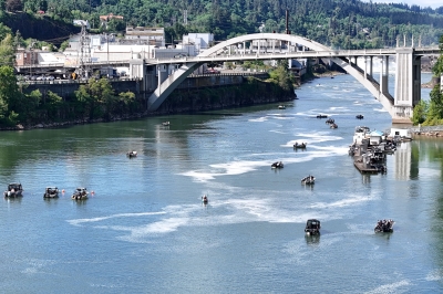 Aerial view of Chinook fishing boats on Willamette river, OR City Bridge in background